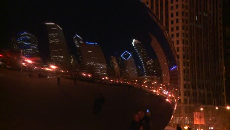 Downtown-Chicago-skyline-at-night-reflected-partly-in-the-Bean-at-Millennium-park-3