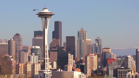 Beautiful-establishing-shot-of-Seattle-Washington-on-a-sunny-day-with-a-helicopter-flying-by