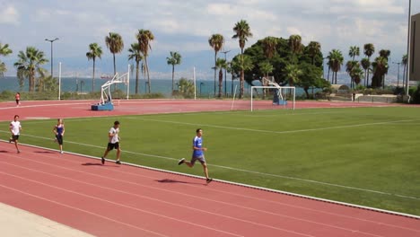Joggers-run-on-the-athletic-field-at-the-American-University-Of-Beirut-in-Lebanon