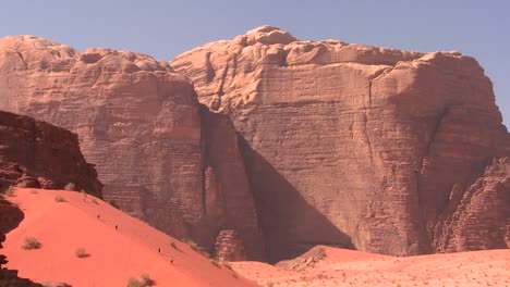 Hikers-explore-the-vast-desert-sands-of-Wadi-Rum-Jordan
