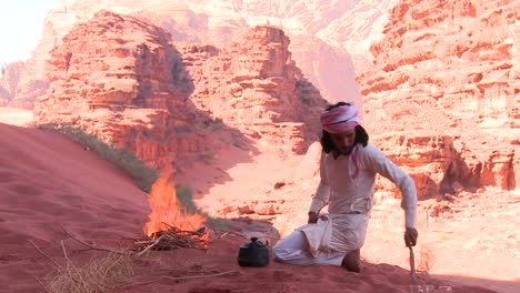 A-Bedouin-man-makes-a-fire-by-hand-in-the-desert-1