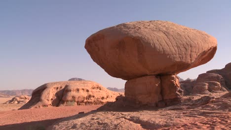 A-rock-shaped-like-a-mushroom-stands-in-the-Saudi-desert-near-Wadi-Rum-Jordan-1