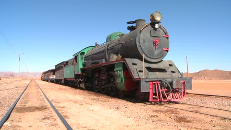 An-old-Turkish-steam-train-used-in-the-movie-Lawrence-of-Arabia-sits-in-the-Saudi-desert-of-Wadi-Rum-Jordan-1
