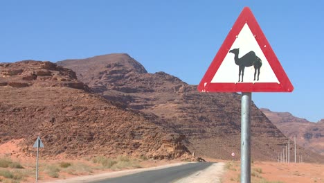 A-road-sign-indicates-camels-are-crossing-in-the-Saudi-desert-of-Wadi-Rum-Jordan