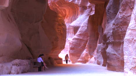 People-walk-through-the-narrow-canyons-leading-up-to-Petra-Jordan