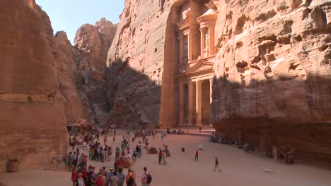 High-angle-view-of-the-facade-of-the-Treasury-building-in-the-ancient-Nabatean-ruins-of-Petra-Jordan-with-tourists