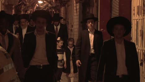 Hassidic-Jews-walk-in-the-Arab-Quarter-of-the-old-city-of-Jerusalem-at-night