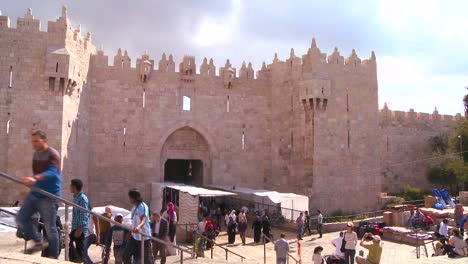 People-walk-out-of-the-Damascus-Gate-in-the-old-city-of-Jerusalem-