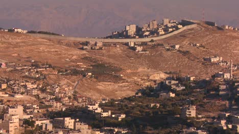 The-new-security-wall-marking-Israel-from-palestine-moves-across-the-distant-hills-of-Israel