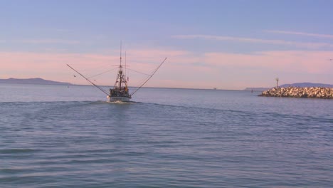 A-fishing-boat-heads-out-of-Santa-Barbara-Harbor