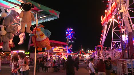 A-carnival-at-night-with-prizes-in-the-foreground