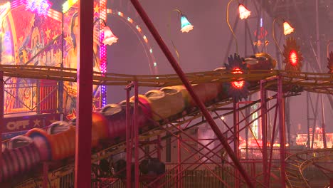 A-small-roller-coaster-at-an-amusement-park-carnival-or-state-fair-at-night-