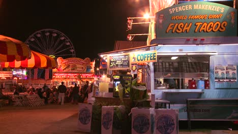 Establishing-shot-of-an-amusement-park-carnival-or-state-fair-at-night--1