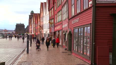 People-walk-along-the-old-streets-of-Bergen-Norway