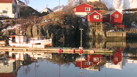 Beautiful-reflections-in-the-water-in-a-village-in-the-Arctic-Lofoten-Islands-Norway