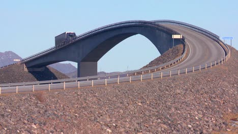 A-truck-travels-over-a-beautiful-bridge-spanning-various-islands-along-the-Atlantic-Road-in-Norway