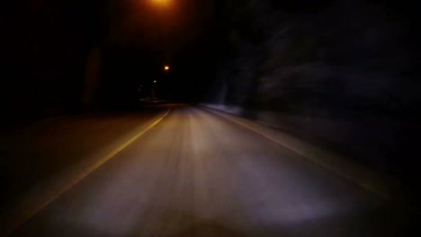 POV-shot-of-a-car-traveling-at-high-speed-through-a-tunnel-through-a-mountain