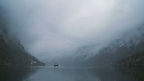 A-ferry-boat-sails-through-mysterious-fog-on-a-fjord-in-Norway-1