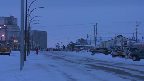 Vehicles-travel-along-an-icy-snowy-road-at-Churchill-Manitoba-Canada-Hudson-Bay