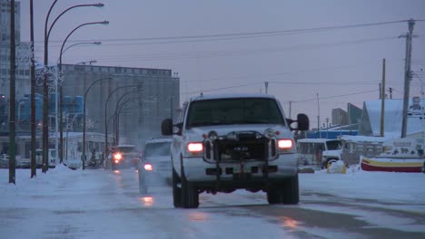 Vehicles-travel-along-an-icy-snowy-road-at-Churchill-Manitoba-Canada-Hudson-Bay-2