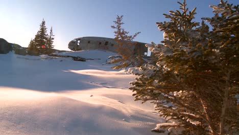 A-crashed-plane-sits-on-a-frozen-snowy-mountainside-in-the-Arctic