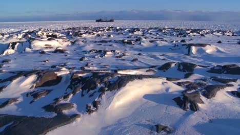A-distant-ship-sits-trapped-in-the-ice-of-frozen-Hudson-Bay-Churchill-Manitoba-Canada