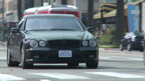 A-black-Mercedes-drives-down-a-Los-Angeles-street