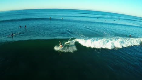 An-vista-aérea-shot-of-a-surfer-riding-the-waves-2