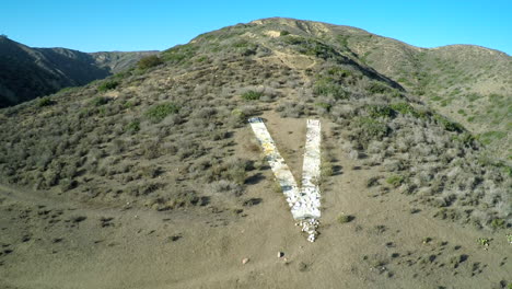 Aerial-shot-over-the-historic-V-on-a-hillside-in-Ventura-California-1