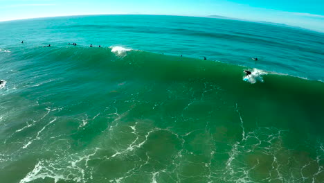 Aerials-over-surfers-riding-waves-on-a-Southern-California-beach
