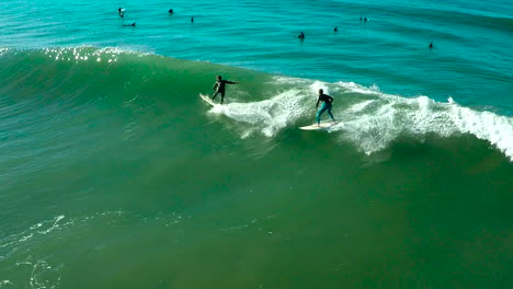 Aerials-over-surfers-riding-waves-on-a-Southern-California-beach-1