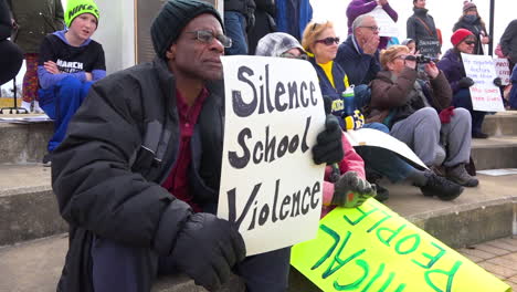Protestors-hold-signs-against-gun-violence-in-schools-during-the-March-For-Our-Lives-Protest-4
