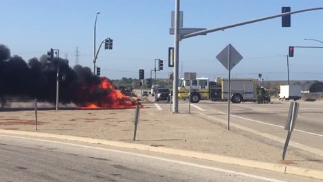 A-car-Kia-Soul-fire-burns-in-an-intersection-with-a-fire-truck-nearby-near-Ventura-California-1