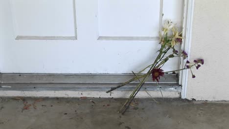 Flowers-are-left-on-a-doorstep