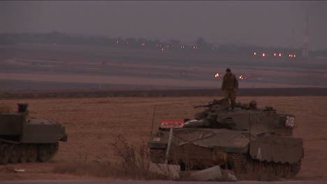 A-soldier-climbs-down-from-an-Israeli-tank