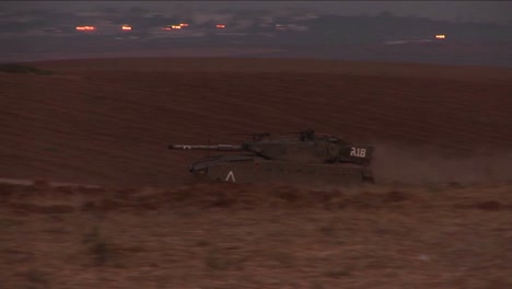 An-Israeli-tank-moves-through-a-no-man's-land-on-the-border-of-Israel-and-the-Gaza-Strip-1