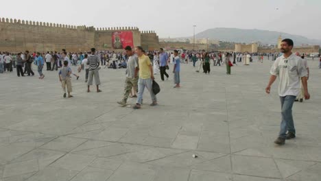 A-time-lapse-of-pedestrians-walking-near-stone-walls-in-Morocco