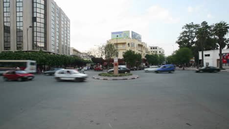 A-time-lapse-of-vehicles-and-pedestrians-passing-through-a-busy-roundabout-in-Casablanca-Morocco