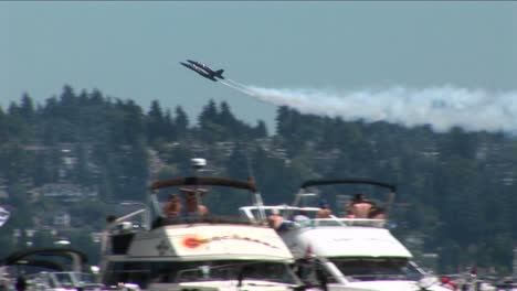 Blue-Angels-jets-fly-over-crowds-of-people-and-boats--