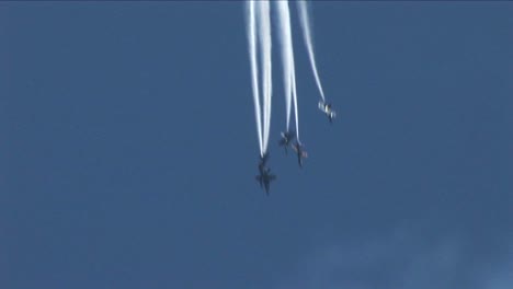 Six-Blue-Angels-jets-fly-downward-and-out-of-formation--