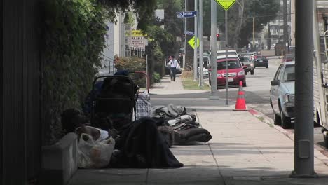 Homeless-men-sit-on-a-sidewalk