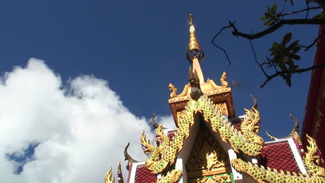 Birds-fly-around-the-top-of-an-ornate-gold-building