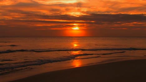 Beach-waves-slowly-break-during-sunset