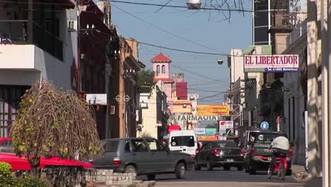 Argentina-town-with-cars-and-businesses-with-signs-in-Spanish