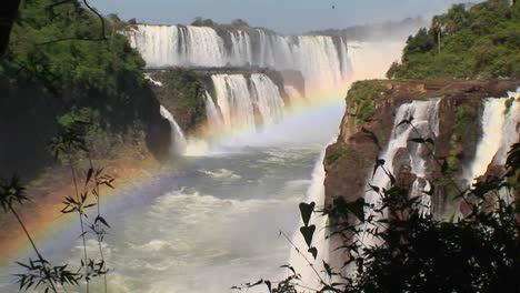 A-zoom-into-Iguacu-Falls-with-a-rainbow-in-the-foreground-1