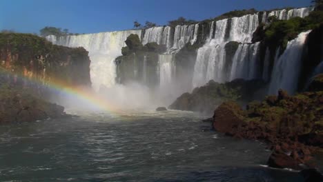 A-beautiful-wide-shot-of-Iguacu-Falls-with-a-rainbow-foreground-1