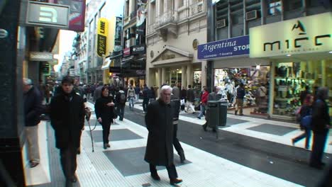 People-walk-through-a-city-shopping-area