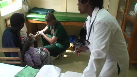 Sick-children-are-getting-a-checkup-by-two-doctors-at-a-clinic