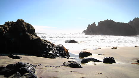 Waves-roll-into-shore-on-a-sunny-day-along-California-coastline-2