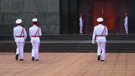 Vietnamese-guards-walk-in-front-of-the-tomb-of-Ho-Chi-Minh